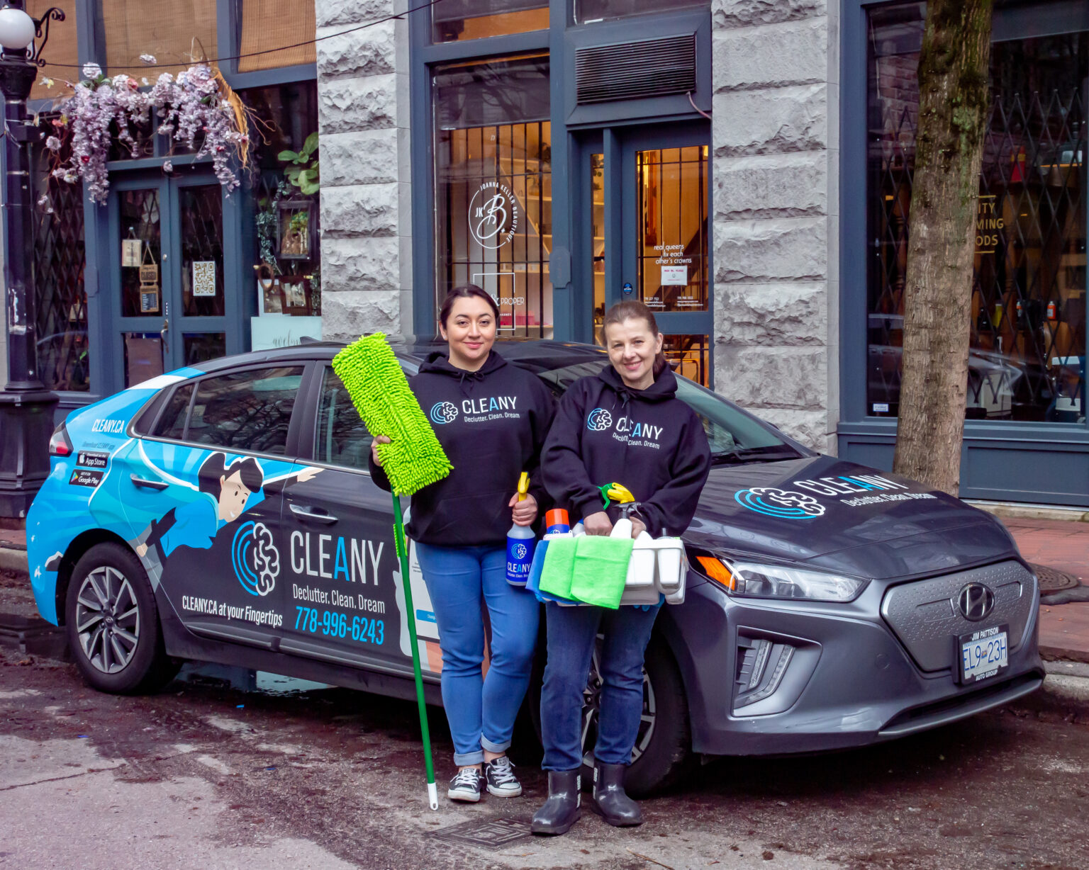 Cleany franchise owners with their branded Cleany car