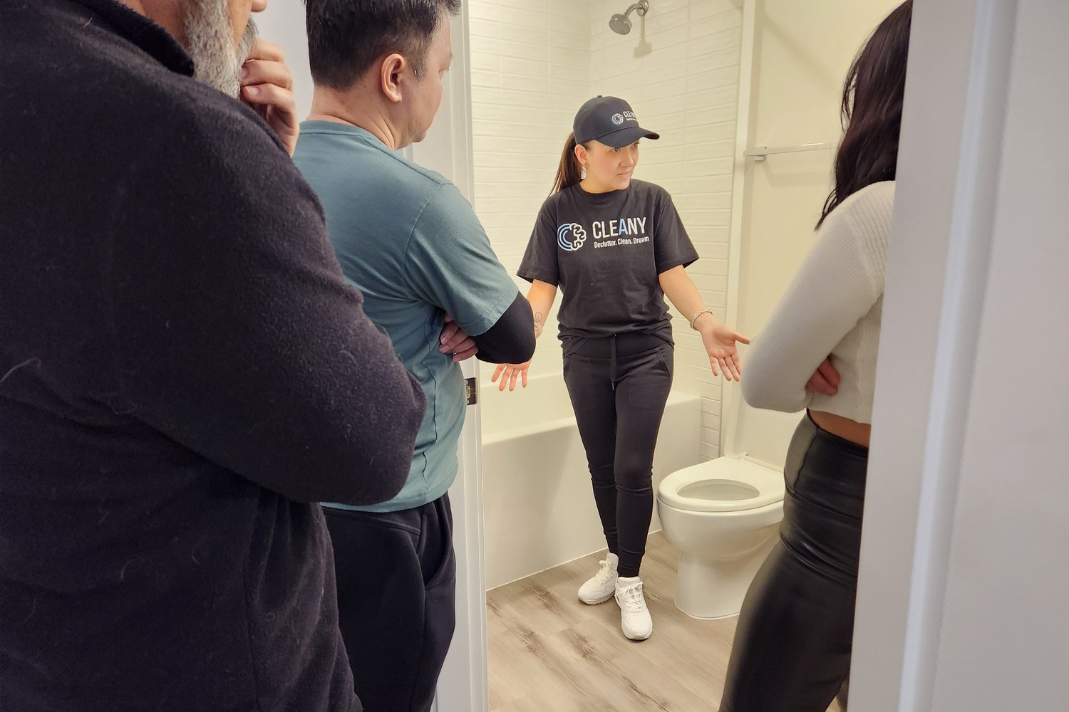 Cleany trainer walking the team through a bathroom clean