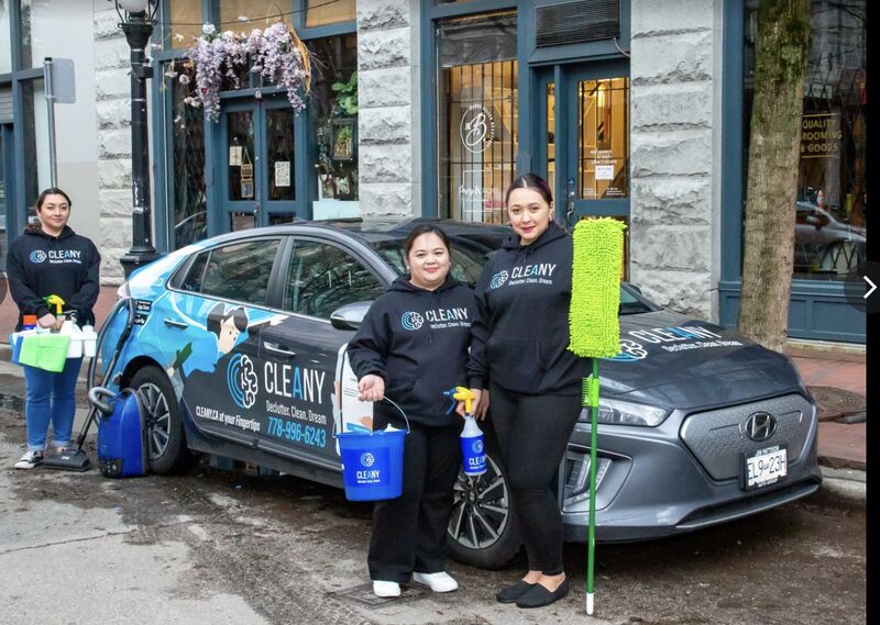 A Cleany franchise team with their branded Cleany car